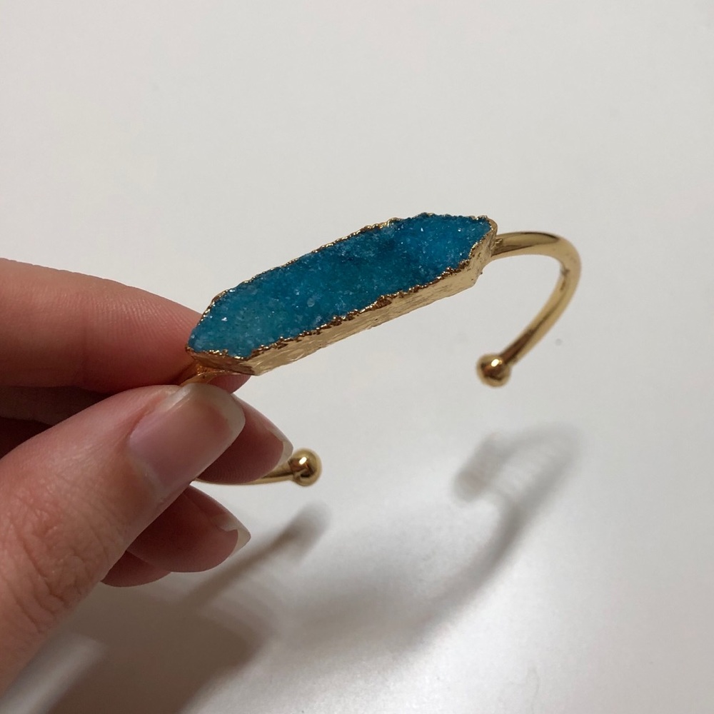 Turquoise rock in gold bracelet band